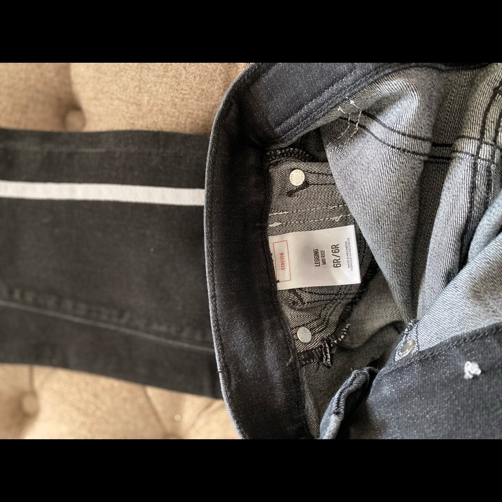 Black jeans with white line